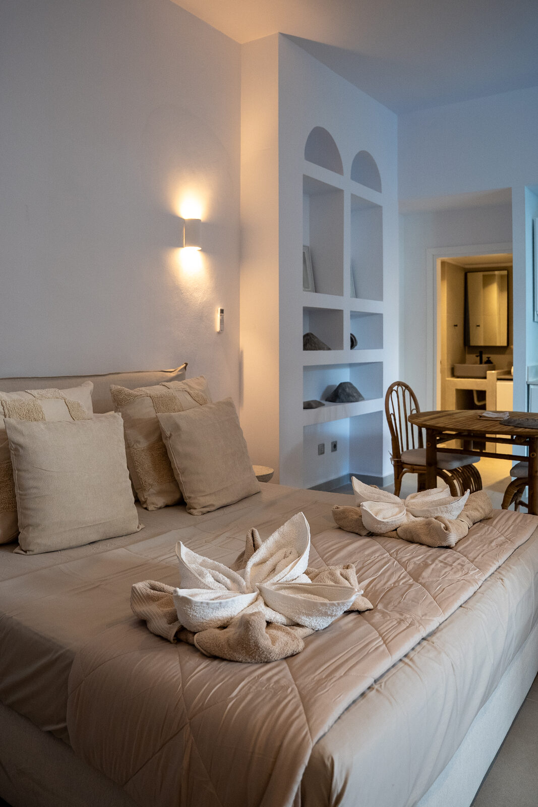 Bedroom with neutral linens and soft lighting